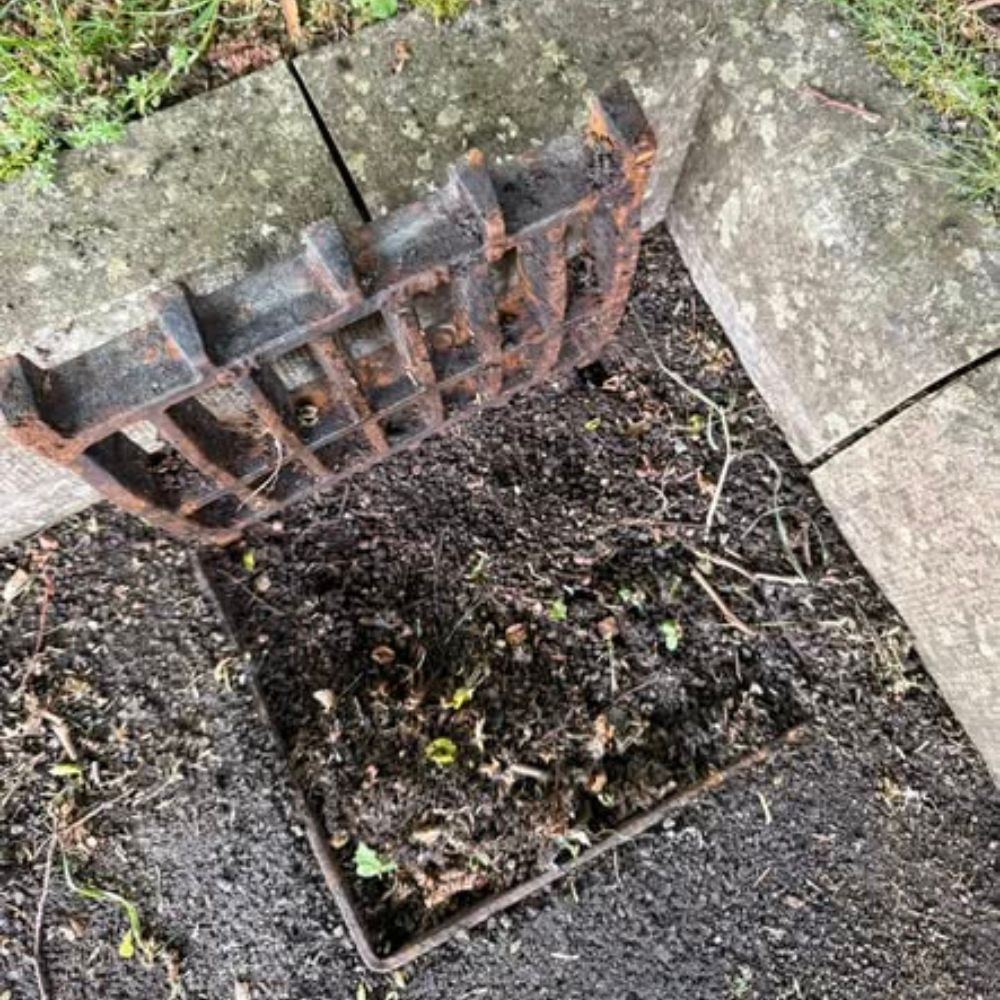 Before &mdash; drains blocked with mud and weeds